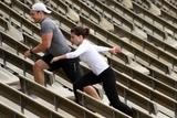 Sophia Bush streching her body at the tracks in Westwood to exercise for her next movie. Exercisign in tight black leggigns showing her ass.