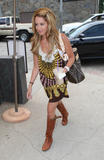 Ashley Tisdale, holds a smoothie while leaving Sharkey's